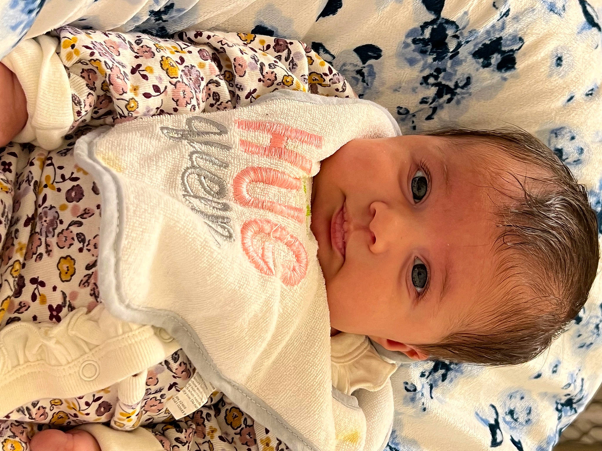 Anna is registered to the contest to win money with this photo: baby, baby_safety, baby_toddler_clothing, cheek, child, comfort, eye, eyelash, happy, head, human_body, iris, linens, lip, nose, pattern, person, skin, sleeve, textile