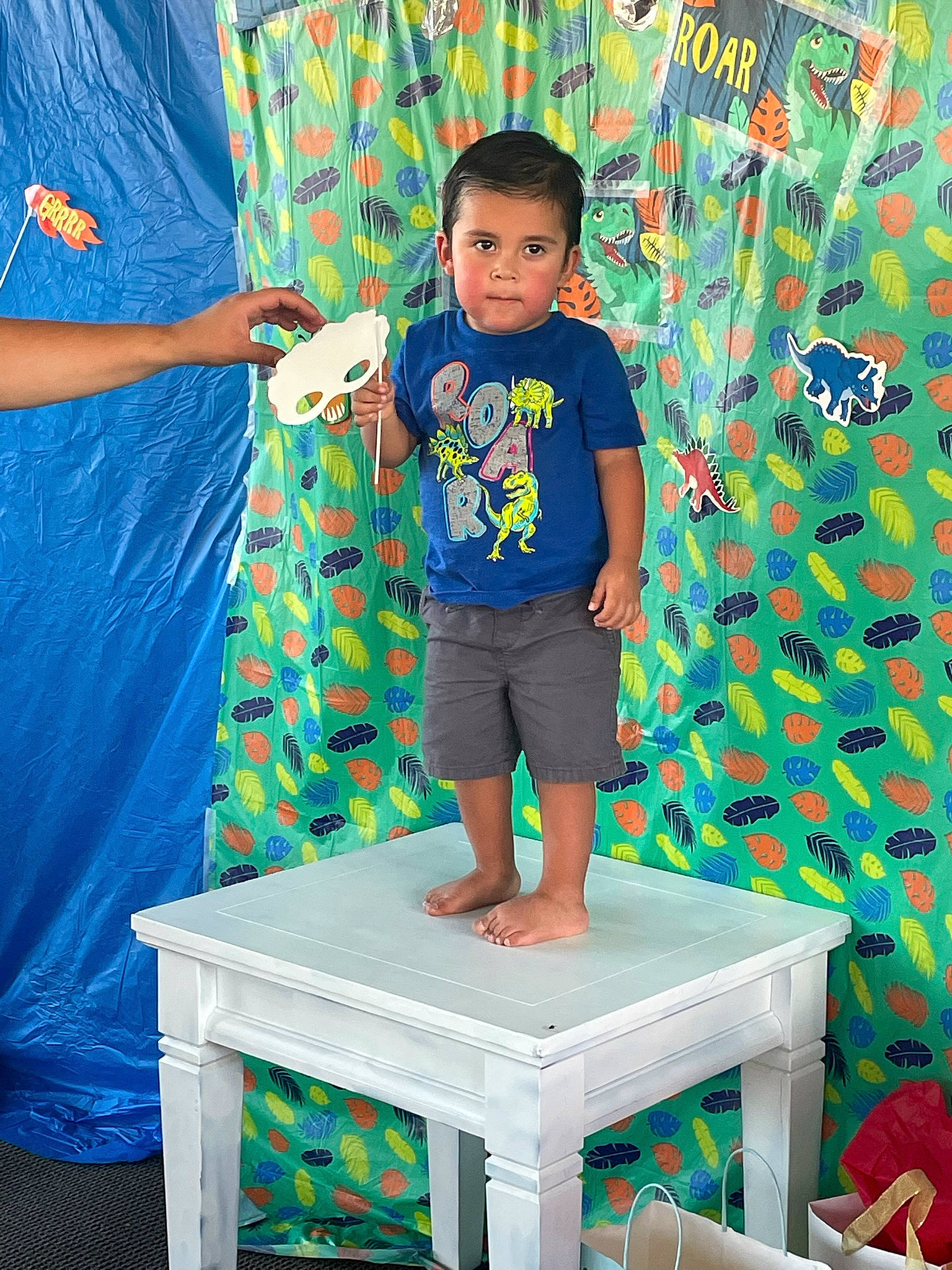 Gabe joined the competition — help win amazing prizes! azure, blue, board_short, child, electric_blue, fun, green, leisure, linens, pattern, person, play, red, room, shirt, shorts, sleeve, t_shirt, table, toddler