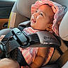 baby, baby_care, car_interior, car_seat, child, closeup, cute, happy, headwear, indoors, infant, person, pink_hat, portrait, safety_harness, seat, seatbelt, smiling, striped_clothing, sunlight