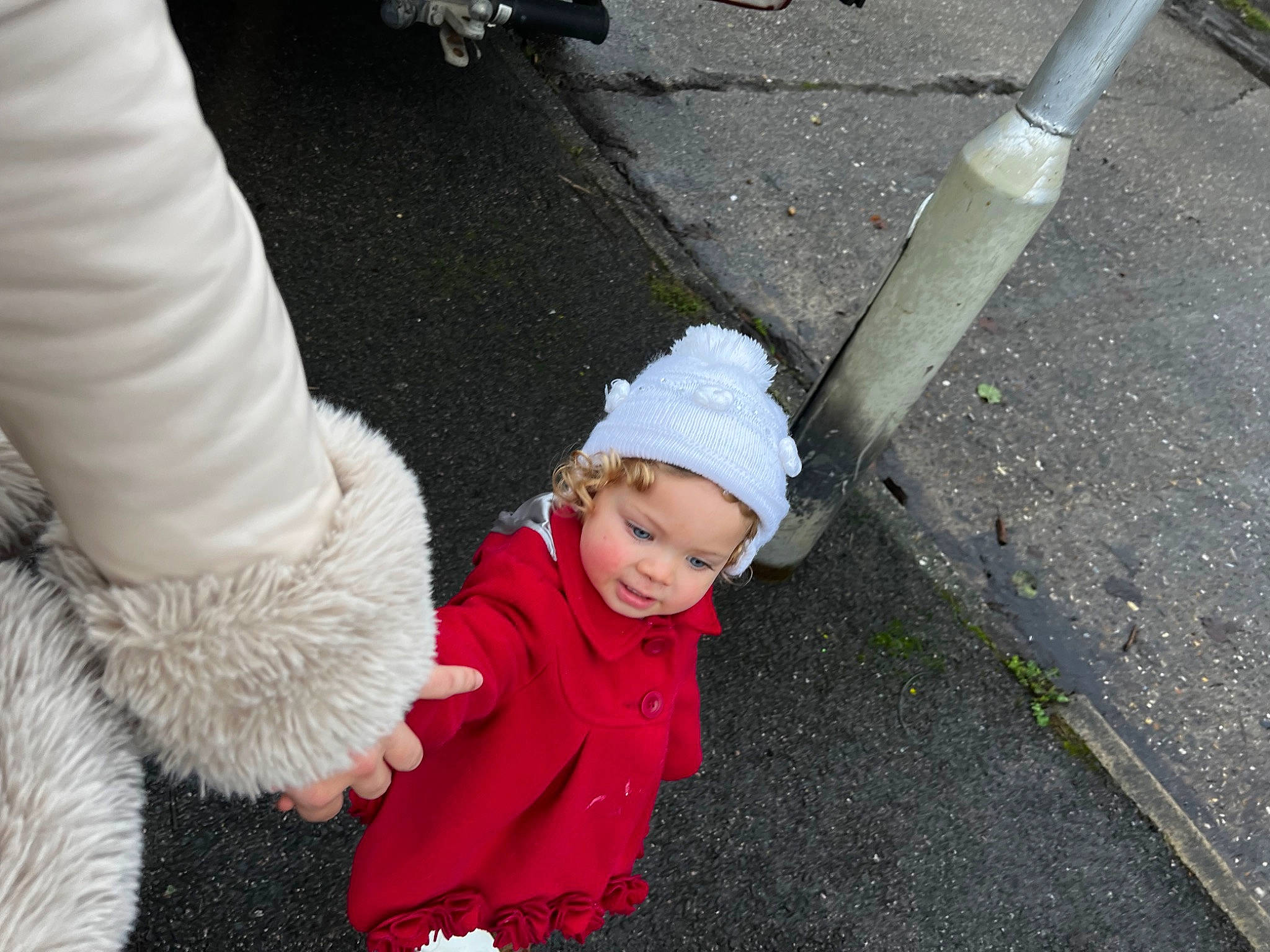Iyla-rose joined the competition — help win amazing prizes! asphalt, baby, baby_toddler_clothing, child, concrete, flooring, gesture, grass, hat, headwear, human_body, knit_cap, person, plant, road, road_surface, sidewalk, tar, toddler, tree