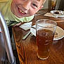 Brayden is registered to the contest to win money with this photo: boy, casual, child, clothing, dessert, drink, face, fork, glass, hair, happy, indoor, napkin, person, plate, restaurant, smiling, spoon, table, wood