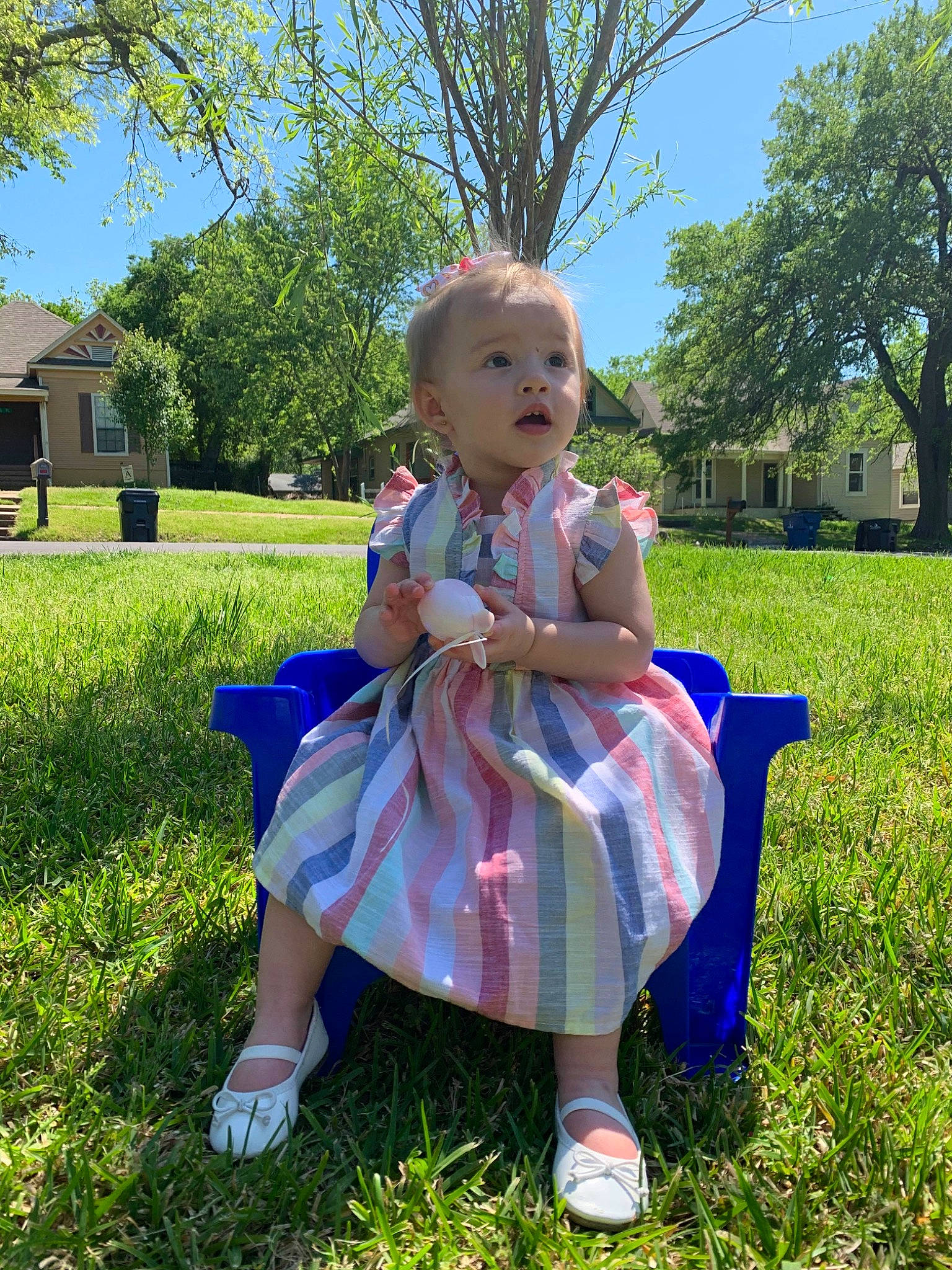 Aaleyah is registered to the contest to win money with this photo: blond, child, dress, flower, garden, grass, grass_family, person, plant, sitting, spring, summer, toddler, tree, wildflower