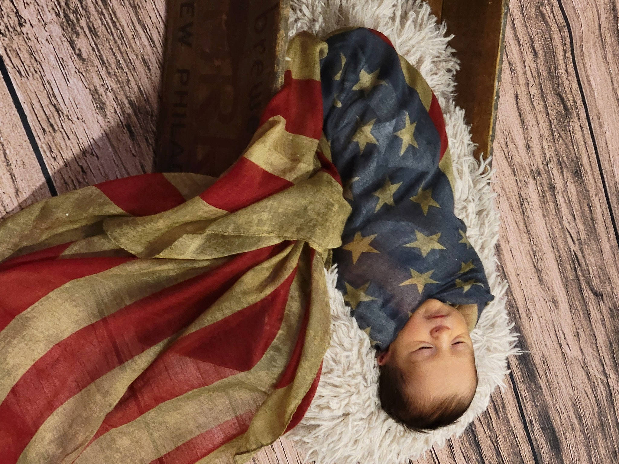 Samuel is registered to the contest to win money with this photo: baby, barefoot, bedding, carmine, child, comfort, flooring, foot, fun, fur, human_leg, linens, pattern, person, room, skin, sleeve, textile, tints_and_shades, toddler