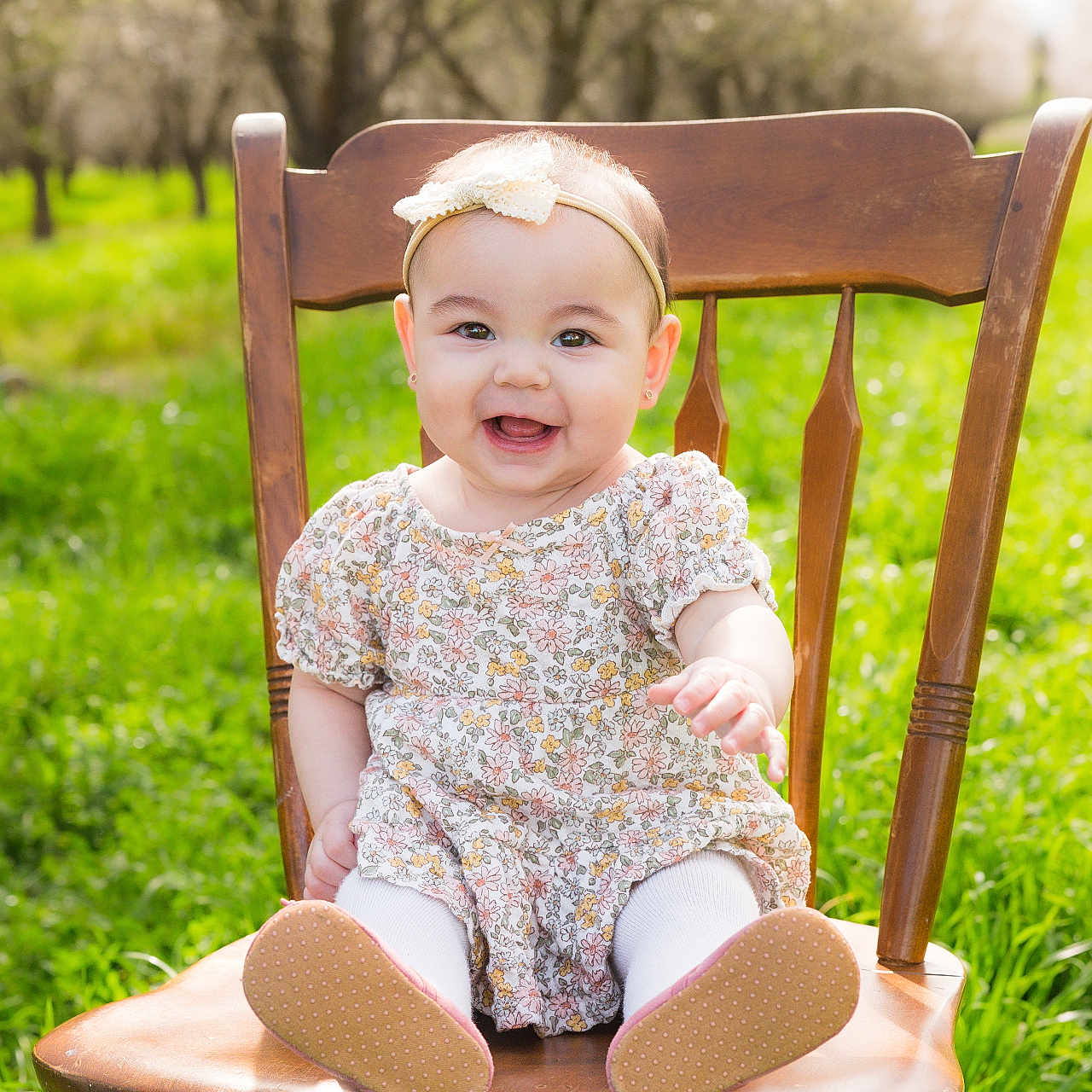 Lianna is registered to the contest to win money with this photo: baby, chair, clothing, face, footwear, furniture, grass, happy, head, lawn, nature, outdoors, pants, park, person, photography, plant, portrait, shoe, sitting