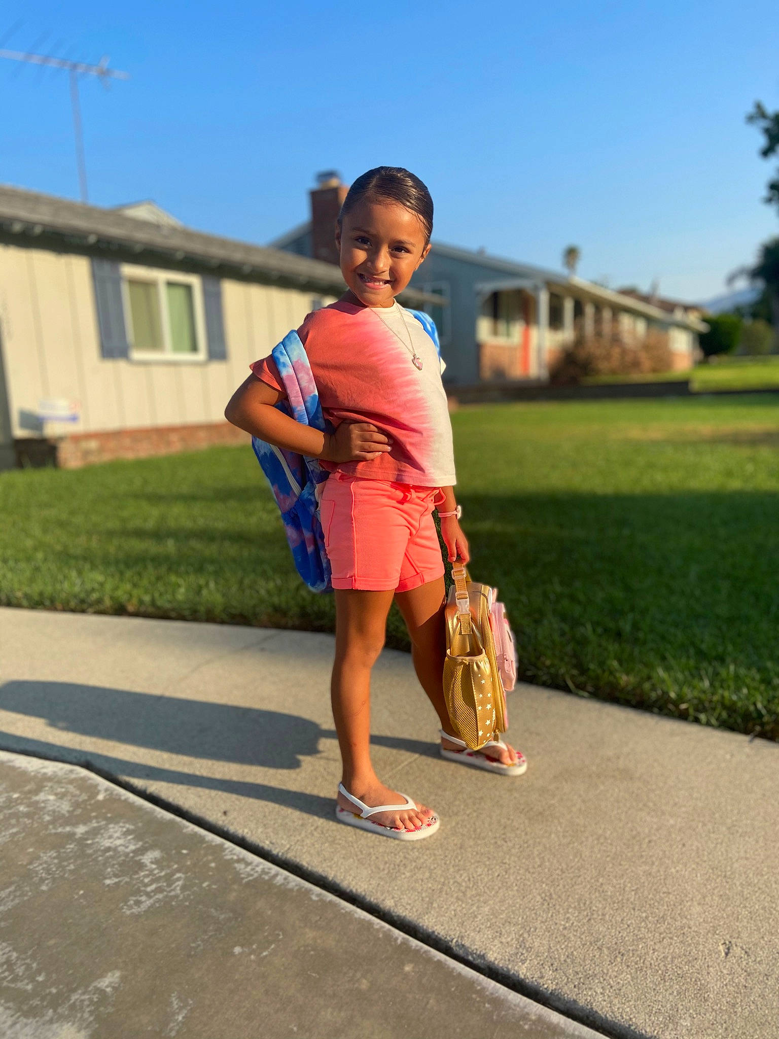 Melissa Navarette is registered to the contest to win money with this photo: asphalt, bag, electric_blue, fun, grass, handbag, happy, human_leg, joy, knee, leisure, luggage_and_bags, person, plant, recreation, road, sky, thigh, toddler, travel