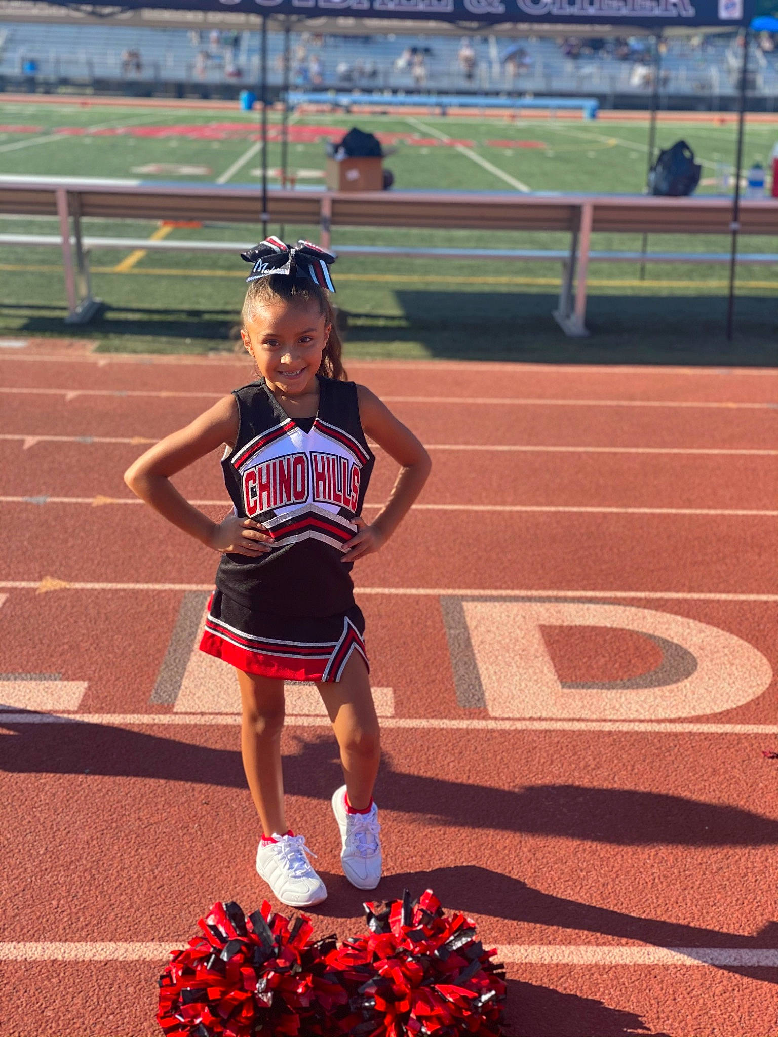 Melissa Navarette joined the competition — help win amazing prizes! athlete, championship, cheerleading_uniform, competition_event, event, grass, jersey, joy, person, plant, player, recreation, red, smile, sports, sports_uniform, sportswear, stadium, team_sport, thigh