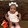 Autumn joined the competition — help win amazing prizes! baby, girl, smiling, bows, dress, socks, plush_toy, clownfish, couch, brown, pattern, happy, child, indoor, cute, infant, seated, furniture, portrait, person