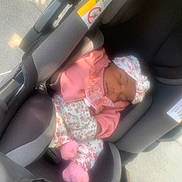 Iyonhia Garcia is registered to the contest to win money with this photo: baby, car_seat, child, cozy, cute, fabric, floral_pattern, headband, infant, newborn, outside, pacifier, peaceful, pink_clothing, resting, seat_belt, sleeping, soft_light, sunlight, toddler