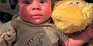Aaron is registered to the contest to win money with this photo: baby, blanket, bodypart, clothing, couch, cushion, face, finger, furniture, hand, head, homedecor, newborn, person, photography, plush, portrait, t_shirt, teddybear, toy