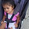 Jream joined the competition — help win amazing prizes! toddler, child, stroller, seatbelt, pink_clothing, curly_hair, hair_accessory, outdoor, gravel, baby, cute, young_child, sitting, portrait, person, summer, casual, daylight, expression, resting