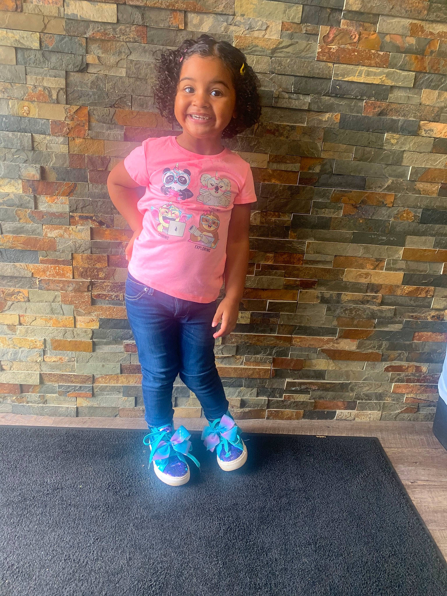 Kailey joined the competition — help win amazing prizes! brick, child, denim, footwear, fun, happy, jeans, joy, leisure, person, photography, pink, play, shoe, smile, standing, t_shirt, toddler, vacation, wall