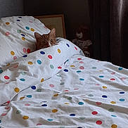Snuggles joined the competition — help win amazing prizes! cat, orange_cat, tabby_cat, bed, duvet, polka_dots, pillow, blanket, teddy_bear, toy, curtains, bedroom, bedding, cozy, pet, peeking, fur, pattern, soft, sleepy