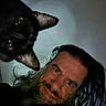 Kuro joined the competition — help win amazing prizes! man, cat, black_cat, beard, long_hair, face, pet, portrait, indoor, curious, closeup, animal, human, whiskers, expression, looking_at_camera, dark_background, head, mustache, friendly