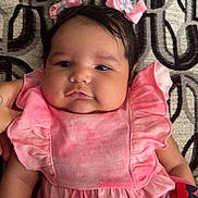 Nova joined the competition — help win amazing prizes! baby, infant, pink_dress, hair_bows, patterned_blanket, chubby_cheeks, cute, child, portrait, lying_down, indoors, soft_fabric, black_hair, hand, smiling, young_child, closeup, adorable, skin, baby_clothing