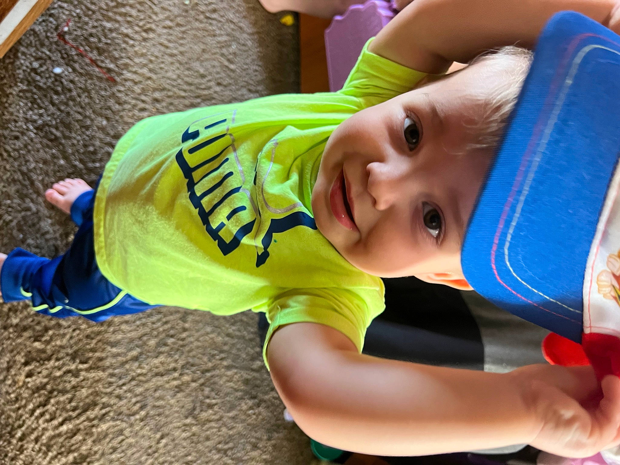 Kayden joined the competition — help win amazing prizes! baby, baby_products, baby_toddler_clothing, child, electric_blue, face, fun, grass, happy, hat, headwear, leisure, person, play, recreation, sleeve, smile, soil, t_shirt, toddler