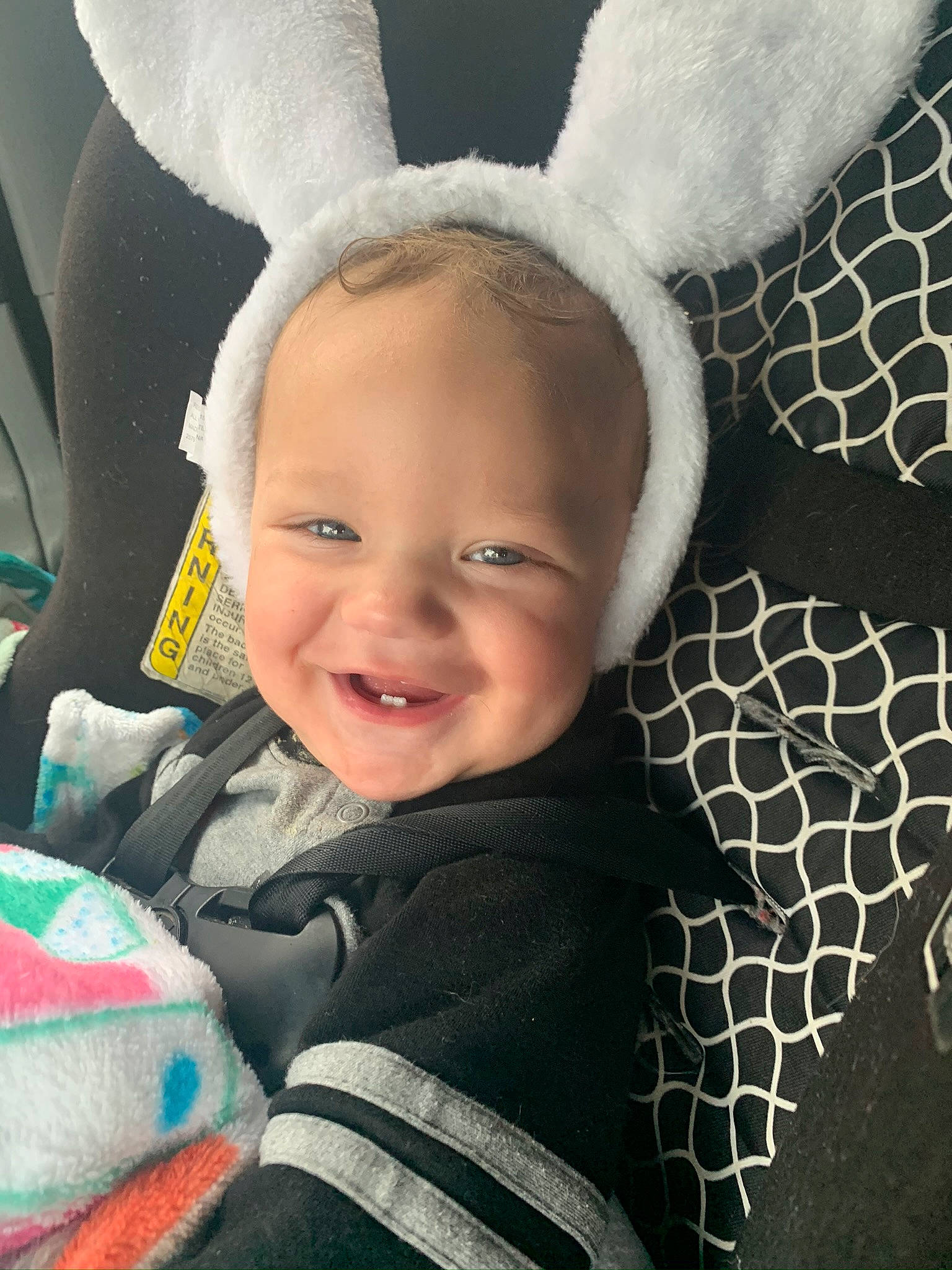 Cason is registered to the contest to win money with this photo: baby, baby_toddler_clothing, black, child, comfort, cool, eye, face, happy, head, iris, joy, outerwear, person, photograph, skin, smile, steering_wheel, textile, toddler