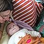 Owen participe au concours pour gagner de l'argent avec cette photo : adult, baby, blanket, celebration, child, christmas_presents, cozy, cuddle, face, family, festive, gift_wrap, glasses, happy, holiday, indoor, person, reindeer_sweater, smile, toddler