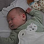 Owen a rejoint le concours — aidez-le/la à gagner de superbes lots ! baby, sleeping, infant, blanket, bed, green_clothing, cute, peaceful, soft_toys, cozy, closeup, face, head, hand, indoors, child, newborn, rest, sleepwear, portrait