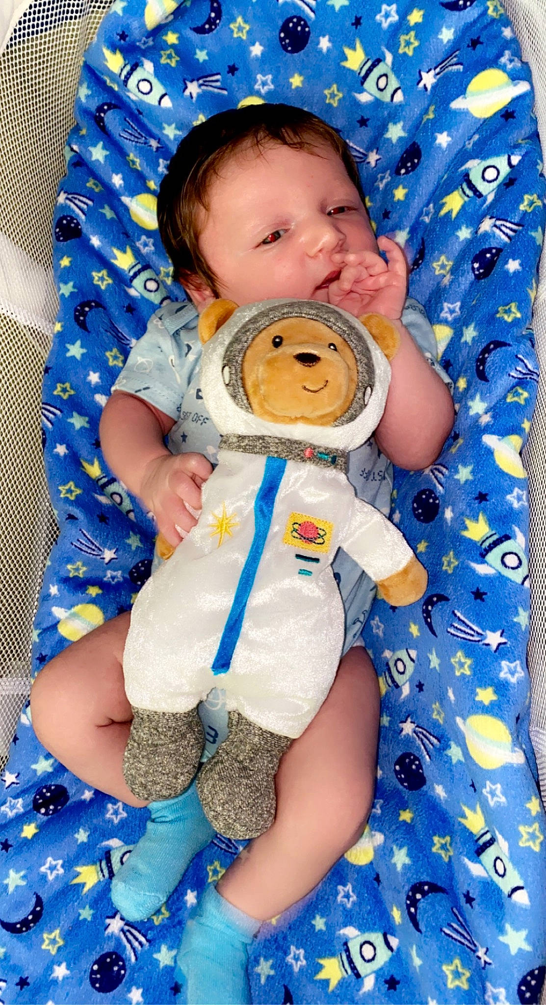 Dexter is registered to the contest to win money with this photo: azure, baby, baby_products, baby_sleeping, baby_toddler_clothing, blue, cheek, child, comfort, electric_blue, fun, happy, orange, pattern, person, product, skin, sleeve, textile, toddler
