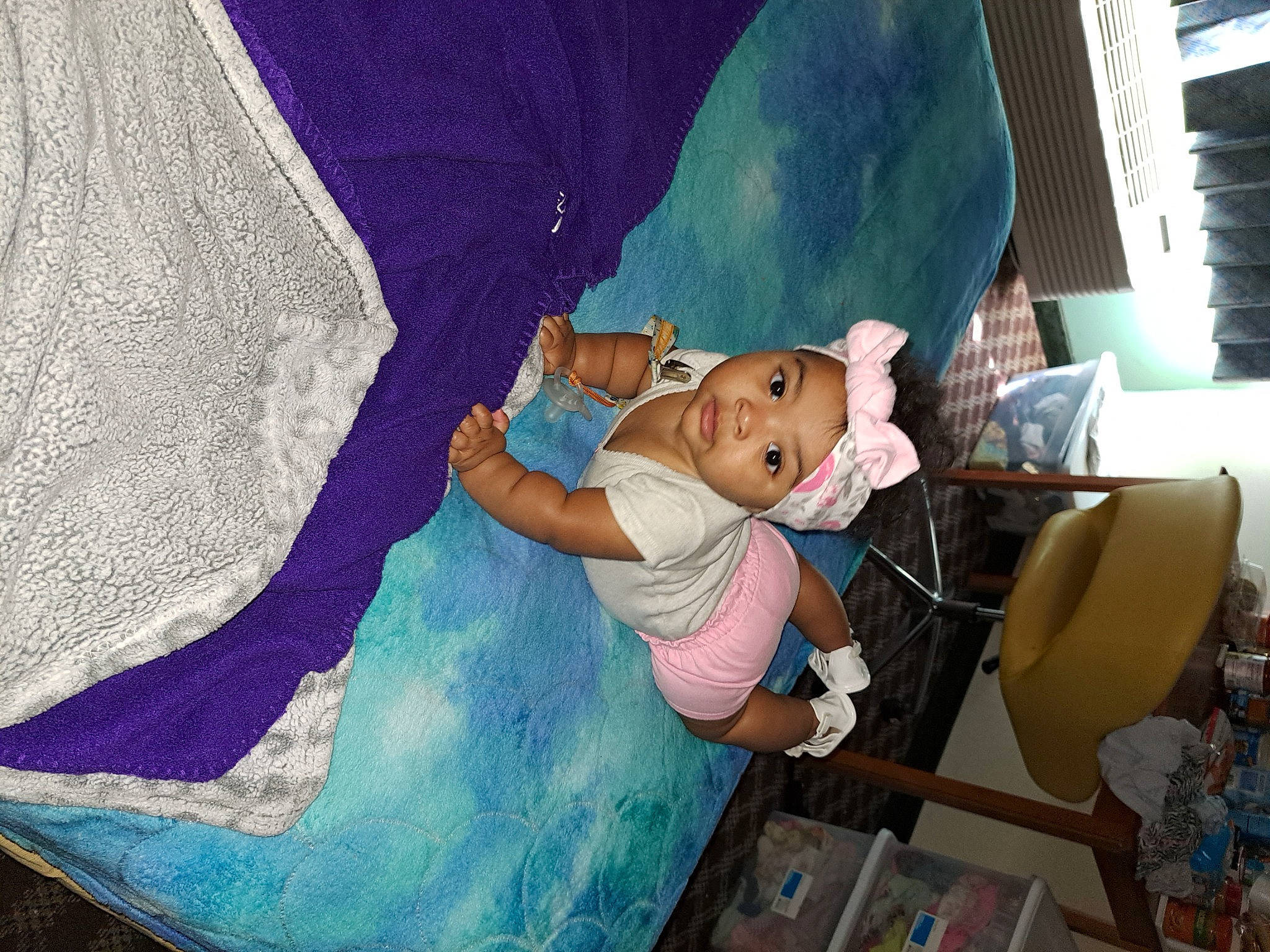 Laiyana is registered to the contest to win money with this photo: animation, art, baby, child, comfort, electric_blue, fictional_character, fun, happy, headwear, leisure, linens, magenta, paint, painting, person, purple, room, sitting, toddler