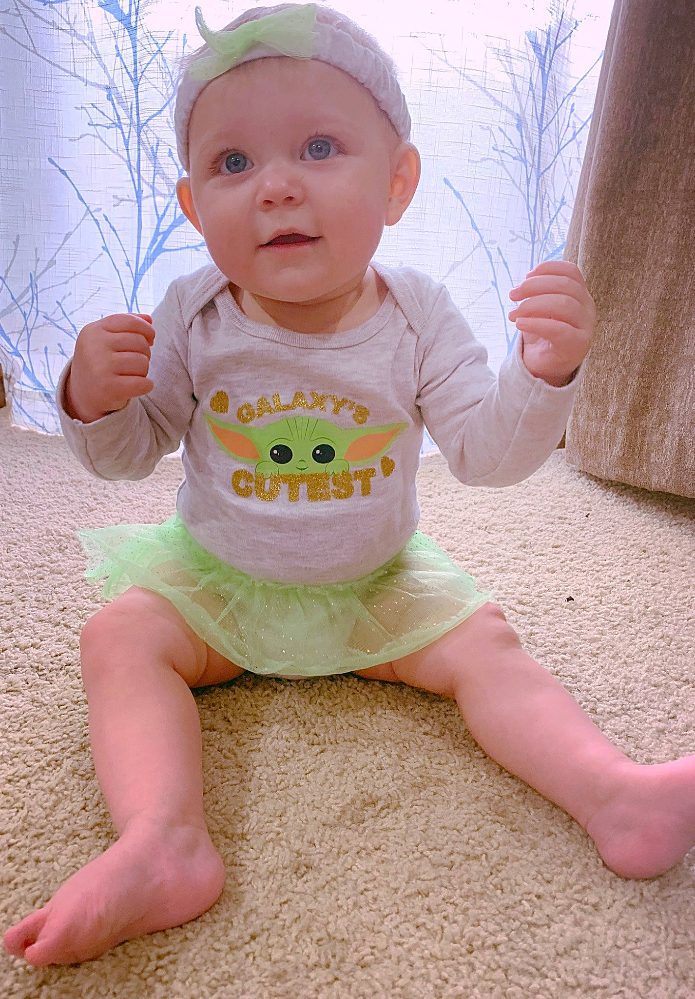 Aurora is registered to the contest to win money with this photo: baby, baby_toddler_clothing, cheek, child, eye, face, finger, grass, happy, head, headwear, human_body, leg, people_in_nature, person, pink, skin, sky, sleeve, smile