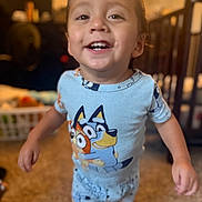 Ezra joined the competition — help win amazing prizes! toddler, child, smiling, pajamas, blue, indoor, carpet, face, person, cute, happy, walking, clothing, home, bedroom, toy, furniture, blurred_background, young_child, playful