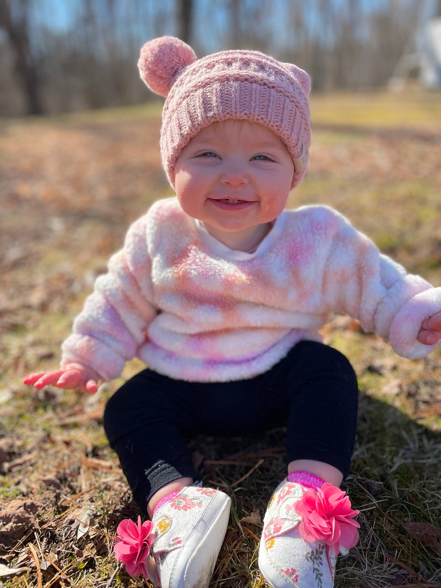 Eleanor is registered to the contest to win money with this photo: baby_toddler_clothing, cap, child, face, grass, grass_family, grassland, happy, hat, head, headwear, human_body, joy, meadow, people_in_nature, person, pink, plant, sky, smile
