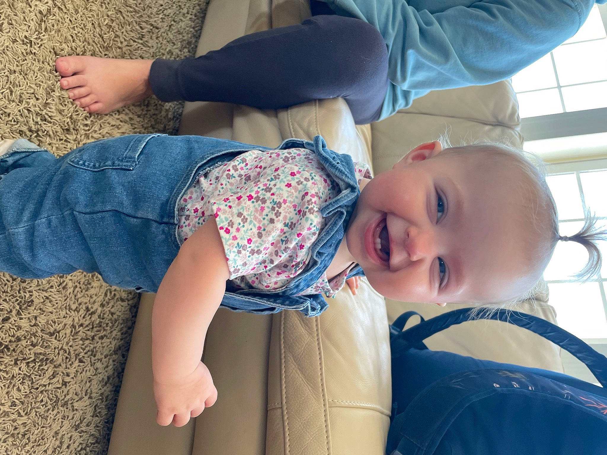 Eleanor is registered to the contest to win money with this photo: baby, baby_toddler_clothing, child, clothing, comfort, cool, electric_blue, fun, gesture, happy, hat, human_body, human_leg, knee, leisure, person, smile, thigh, toddler, tree