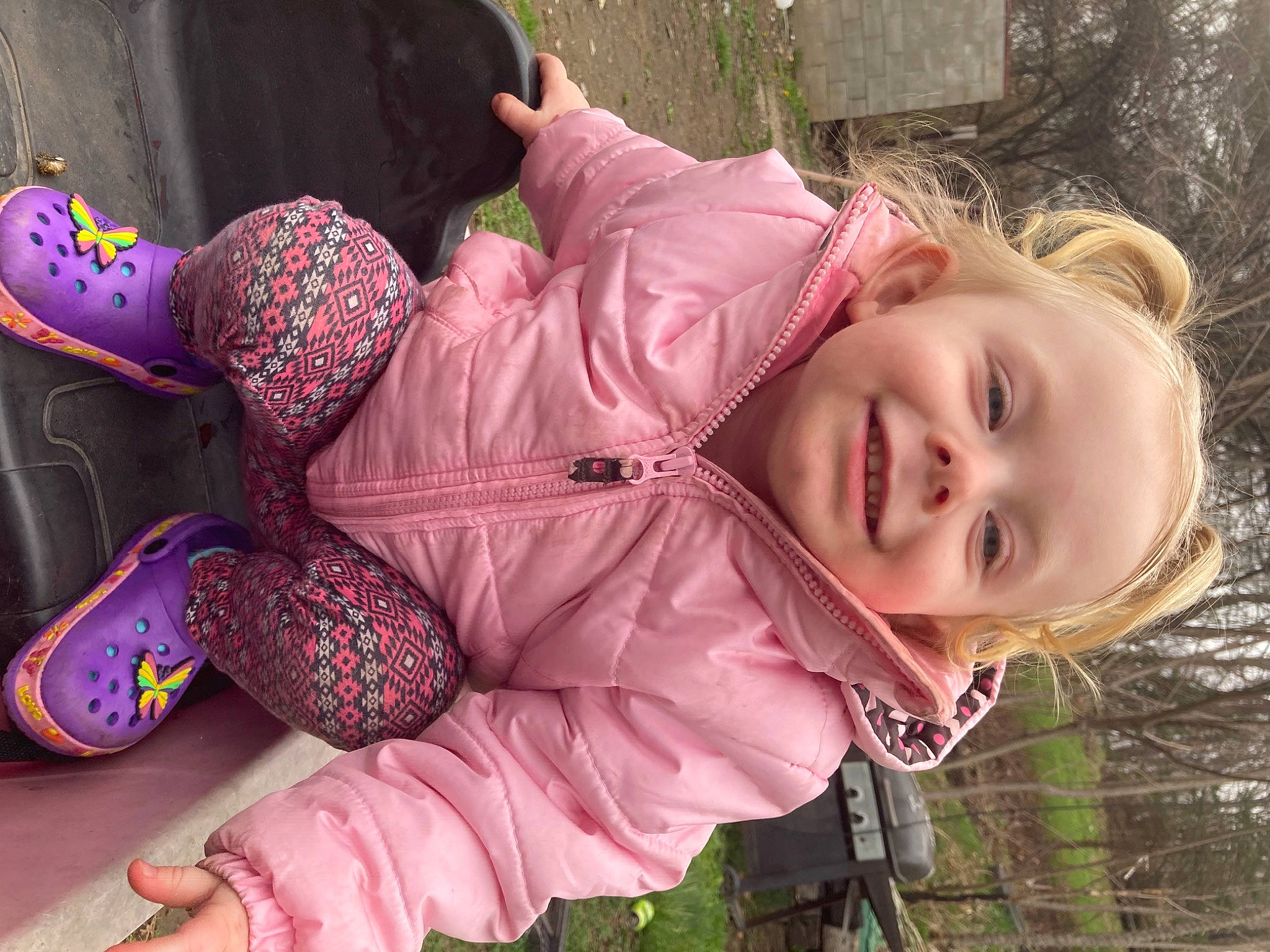 Agnes is registered to the contest to win money with this photo: baby_toddler_clothing, child, clothing, fun, grass, green, happy, human, joy, leisure, magenta, mammal, people_in_nature, person, pink, plant, sitting, skin, smile, textile