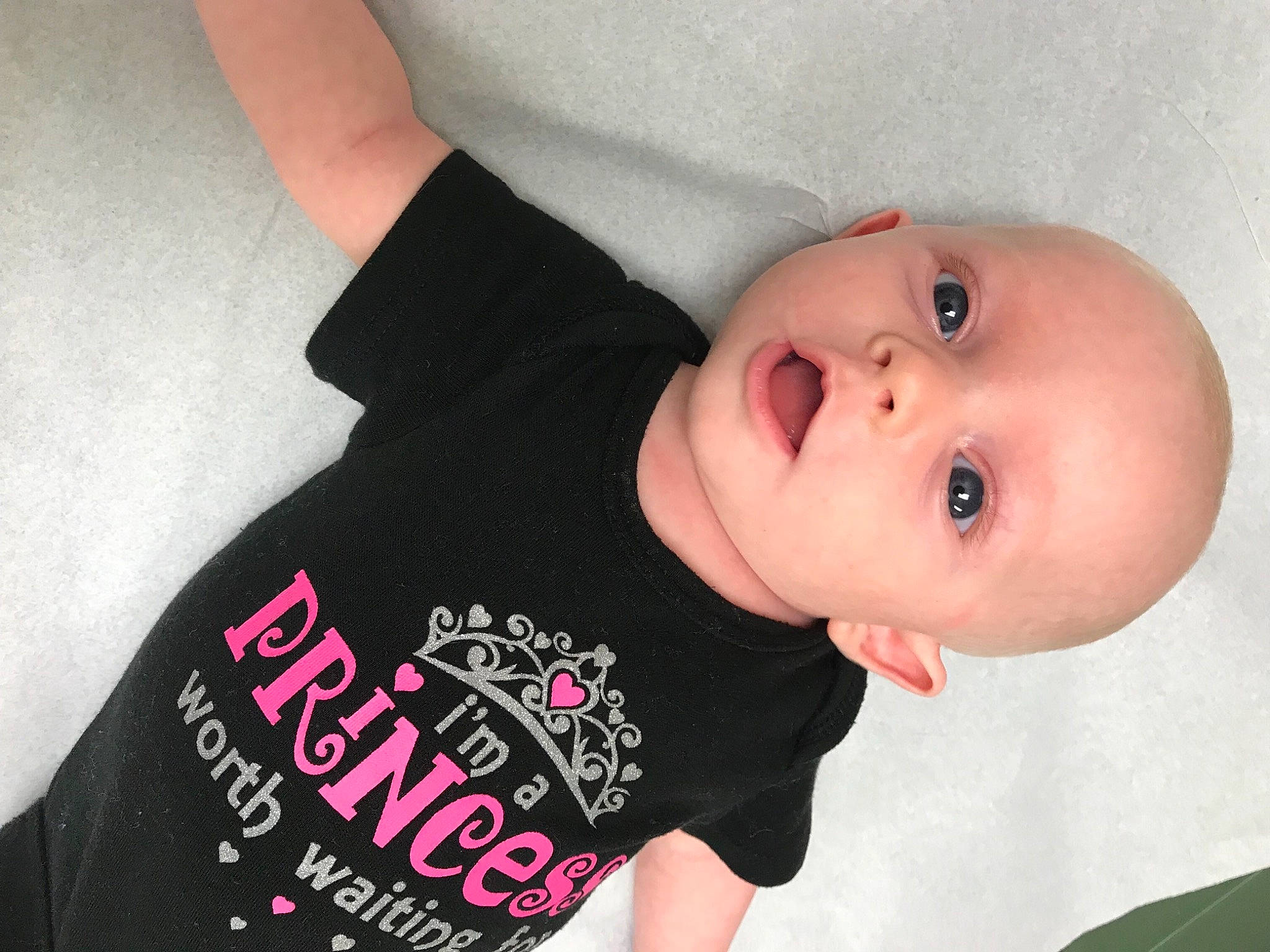Brooklyn is registered to the contest to win money with this photo: arm, baby, baby_products, baby_toddler_clothing, cheek, child, neck, person, pink, product, skin, sleeve, t_shirt, toddler