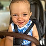 Noa participe au concours pour gagner de l'argent avec cette photo : baby, blue_clothing, child, closeup, cute, dimples, eyes, face, hands, happy, head, indoor, infant, person, portrait, seatbelt, skin, smiling, stroller, young_child