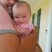 Akaya joined the competition — help win amazing prizes! arm, baby, beard, child, clothing, face, family, freckles, happy, home, hug, indoor, man, person, portrait, shutters, smile, striped, window, yellow_wall