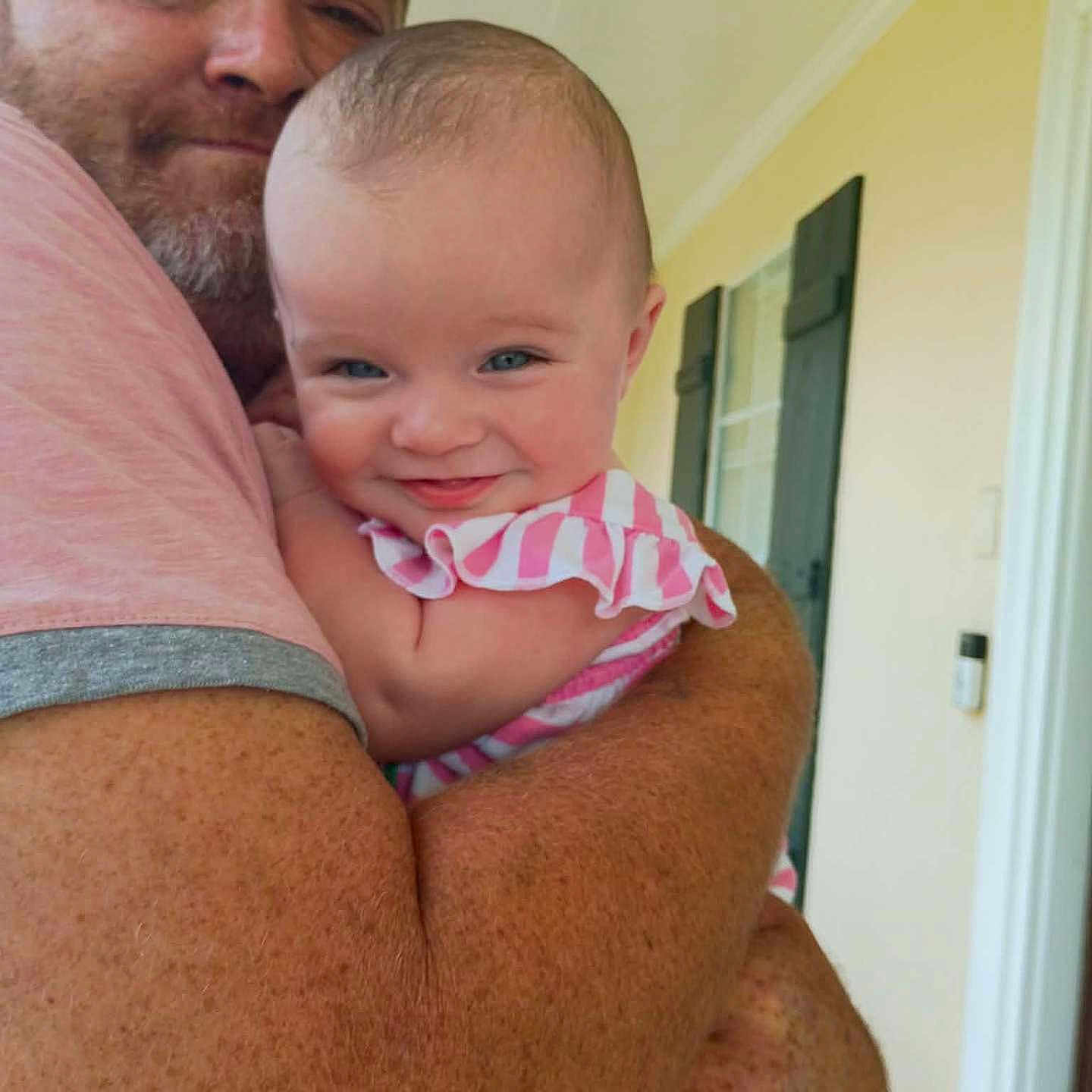 Akaya joined the competition — help win amazing prizes! arm, baby, beard, child, clothing, face, family, freckles, happy, home, hug, indoor, man, person, portrait, shutters, smile, striped, window, yellow_wall
