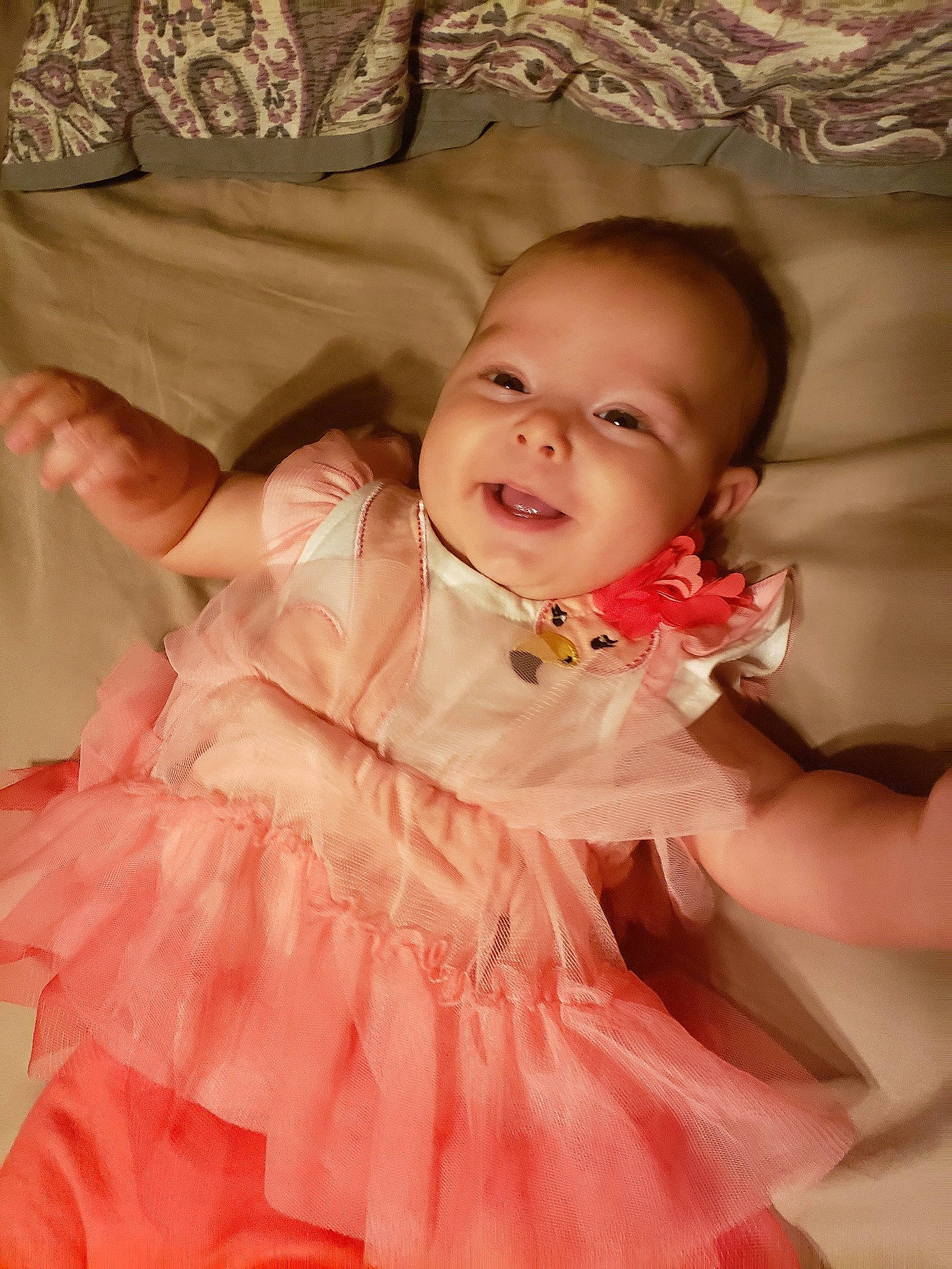 Genevieve is registered to the contest to win money with this photo: baby, baby_toddler_clothing, cheek, child, dress, joy, peach, person, pink, product, skin, smile, textile, toddler