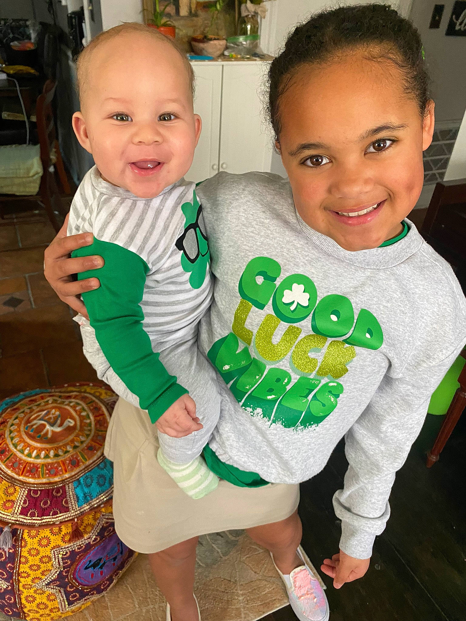 Kyrie is registered to the contest to win money with this photo: baby, baby_toddler_clothing, child, dress, event, face, facial_expression, fun, green, hairstyle, happy, head, joy, pattern, person, product, skin, sleeve, smile, t_shirt