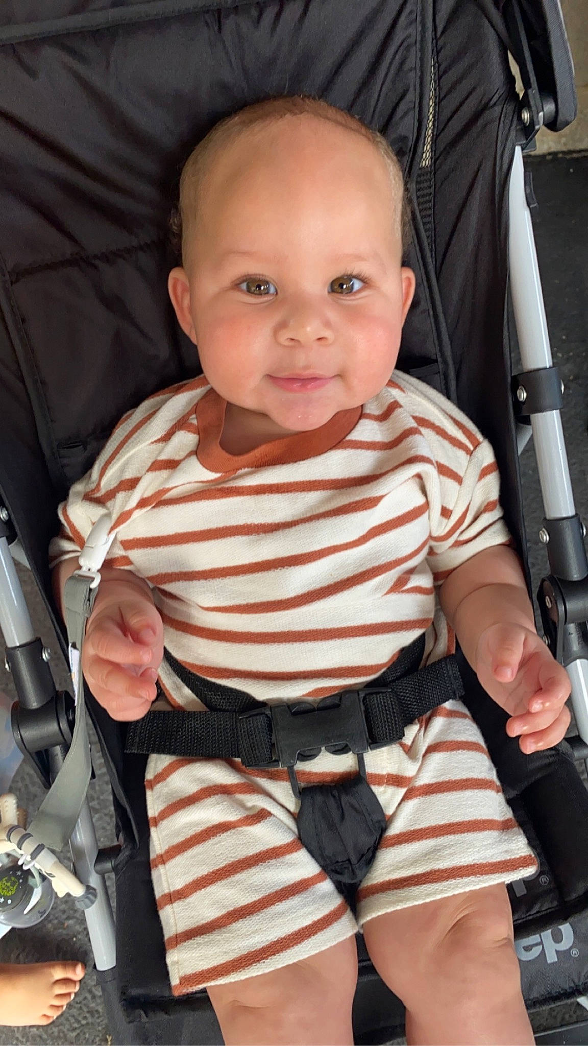 Kyrie joined the competition — help win amazing prizes! baby, baby_carriage, baby_products, baby_toddler_clothing, car_seat, chair, cheek, child, comfort, finger, organ, person, product, seat_belt, sitting, skin, sleeve, smile, t_shirt, thumb