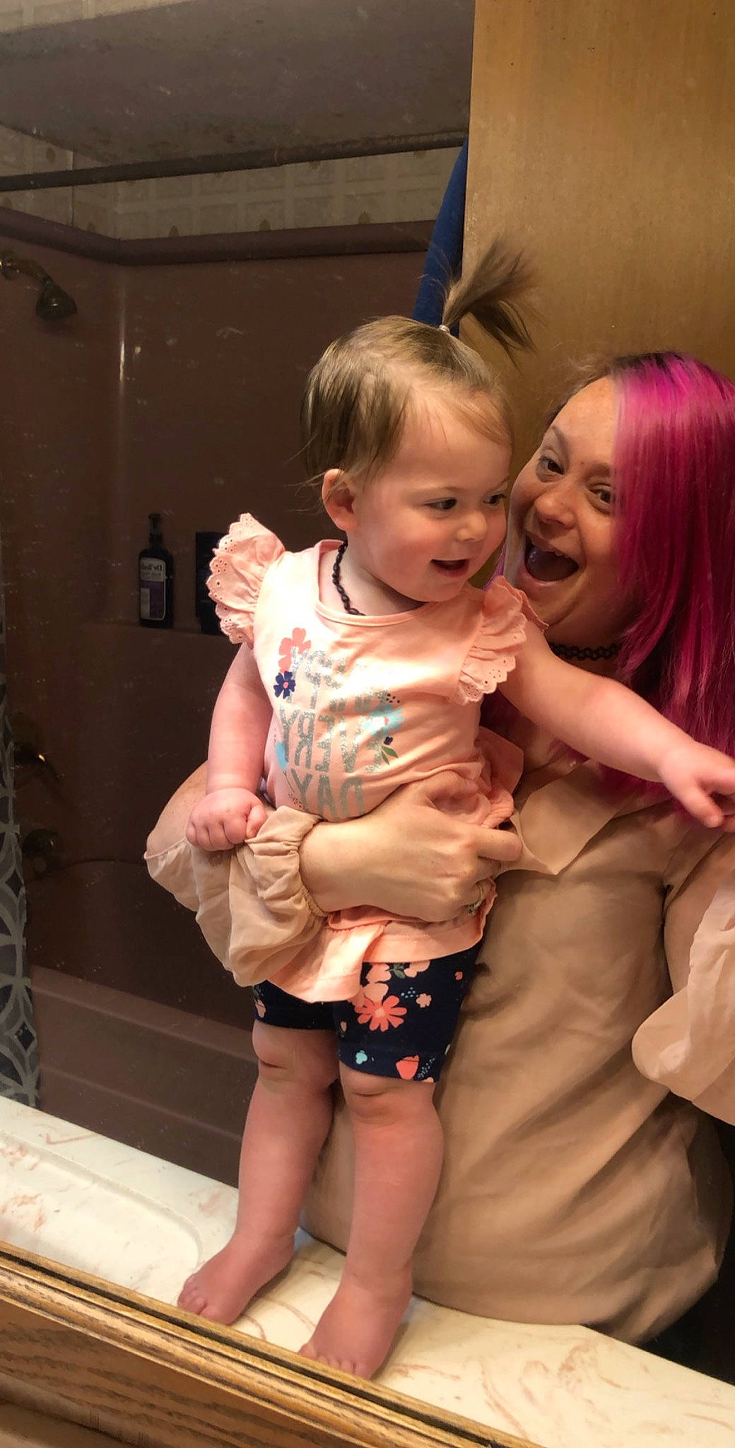 Hope is registered to the contest to win money with this photo: abdomen, baby, cheek, child, ear, finger, fun, hand, happy, interaction, joy, leg, person, pink, sitting, skin, smile, thumb, toddler, vacation