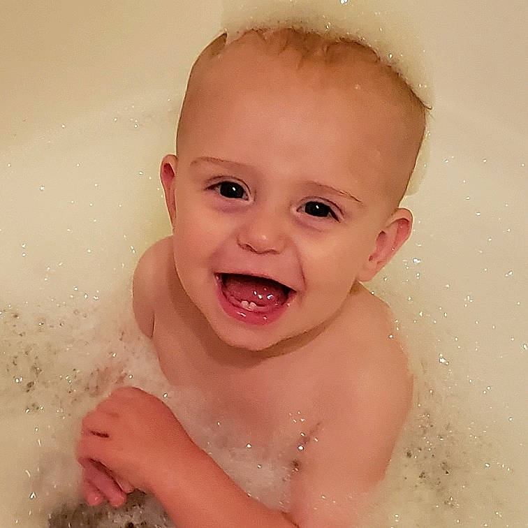 Ashtyn is registered to the contest to win money with this photo: baby, baby_bathing, baby_making_funny_faces, bathing, bathtub, cheek, child, chin, eyebrow, face, facial_expression, forehead, head, lip, mouth, nose, organ, person, skin, smile