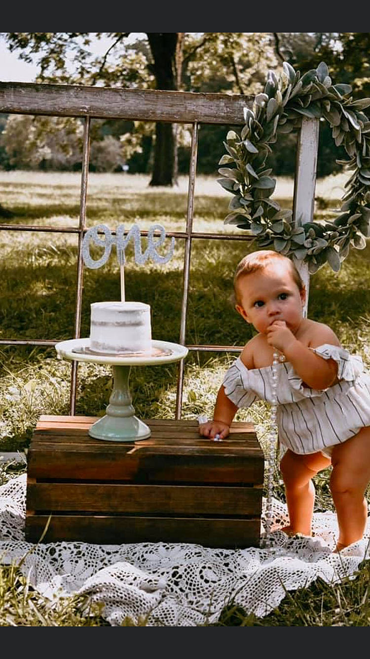 Everleigh joined the competition — help win amazing prizes! cake, child, dress, fashion_accessory, furniture, person, photograph, photography, ruffle, shoe, swing, table, toddler, wedding_ceremony_supply