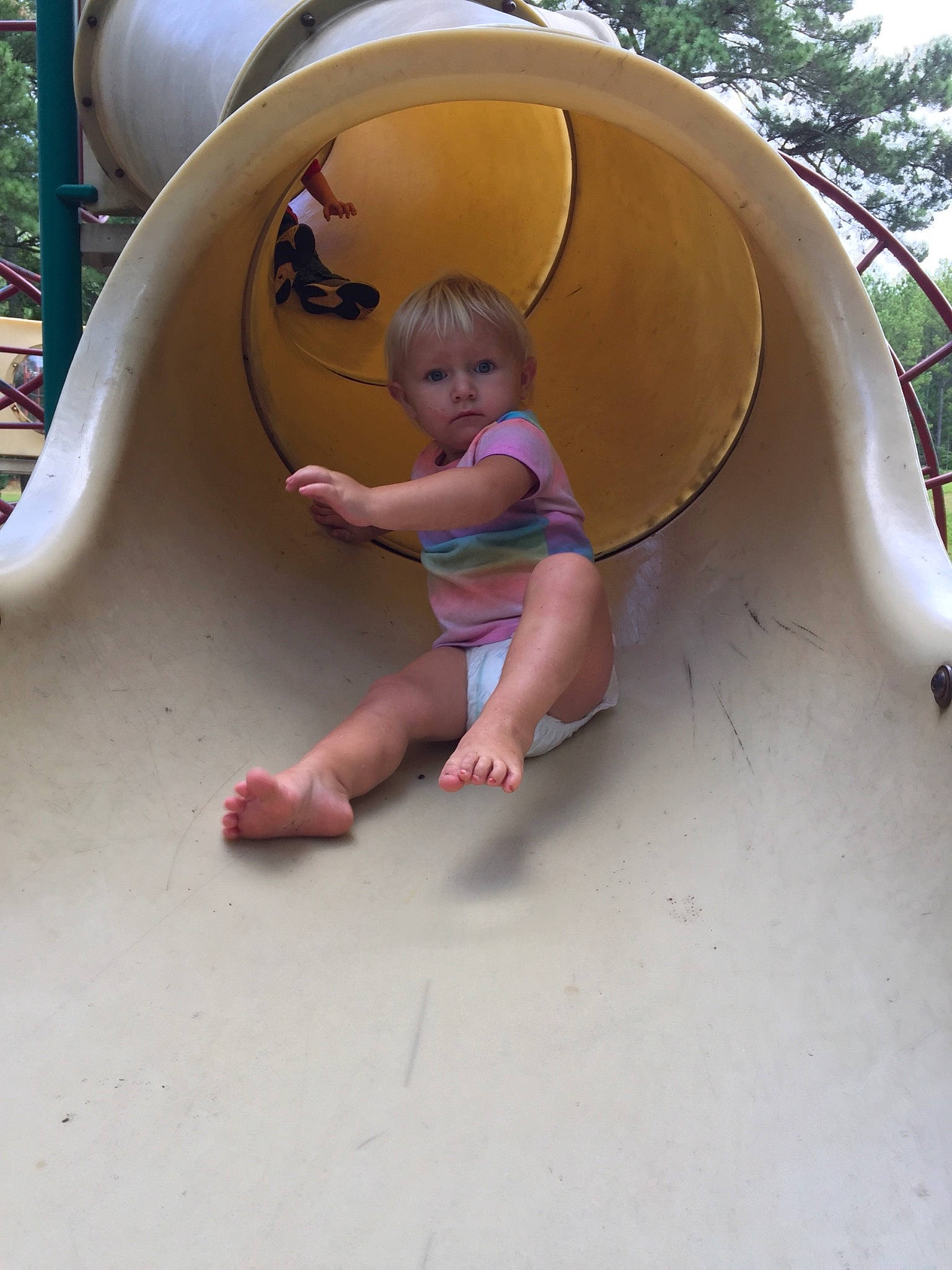 Skylin is registered to the contest to win money with this photo: child, chute, city, fun, human_settlement, leisure, outdoor_play_equipment, person, play, playground, playground_slide, public_space, recreation, summer, toddler, vacation