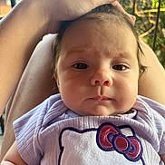 Matilda is registered to the contest to win money with this photo: baby, infant, face, hand, hello_kitty, shirt, purple, outdoor, railing, person, cute, child, portrait, clothing, skin, head, expression, sitting, young, nature
