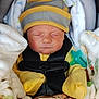 Jaxson joined the competition — help win amazing prizes! baby, newborn, sleeping, car_seat, blanket, hat, pacifier, yellow_clothing, safety_harness, infant, cozy, child, cute, resting, soft, bundle, indoors, comfort, peaceful, face