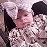 newborn, baby, infant, child, portrait, face, eyes, bow, headband, striped, clothing, blanket, animal_print, cozy, reclining, indoor, chair, home, sleepy, cute
