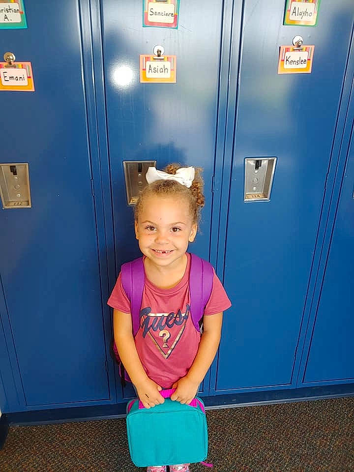 Asiah is registered to the contest to win money with this photo: child, joy, locker, person, standing, toddler