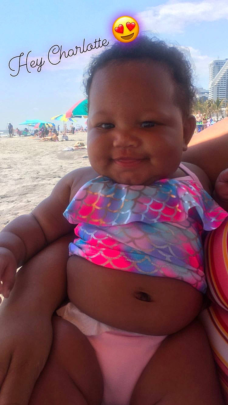 Charlotte is registered to the contest to win money with this photo: abdomen, baby, beauty, cheek, child, face, fun, head, human, joy, leg, lip, neck, person, pink, skin, smile, summer, sun_tanning, toddler