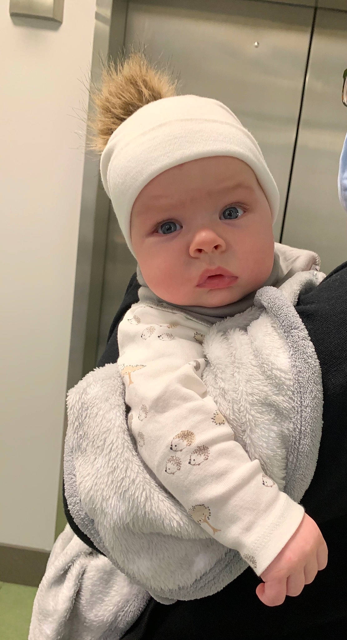 Dash is registered to the contest to win money with this photo: baby, baby_products, baby_toddler_clothing, bonnet, cheek, child, fur, hair_accessory, headband, headpiece, headwear, hood, person, toddler