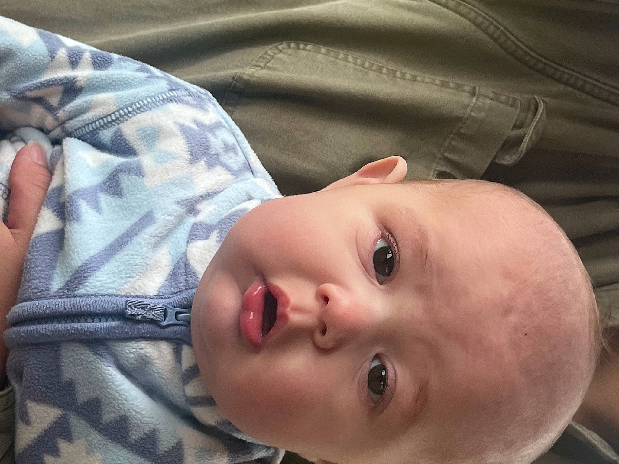 Phoenix is registered to the contest to win money with this photo: baby, baby_products, baby_toddler_clothing, cheek, child, comfort, eyebrow, eyelash, grass, happy, iris, lip, mouth, nose, pattern, person, portrait_photography, skin, sleeve, smile