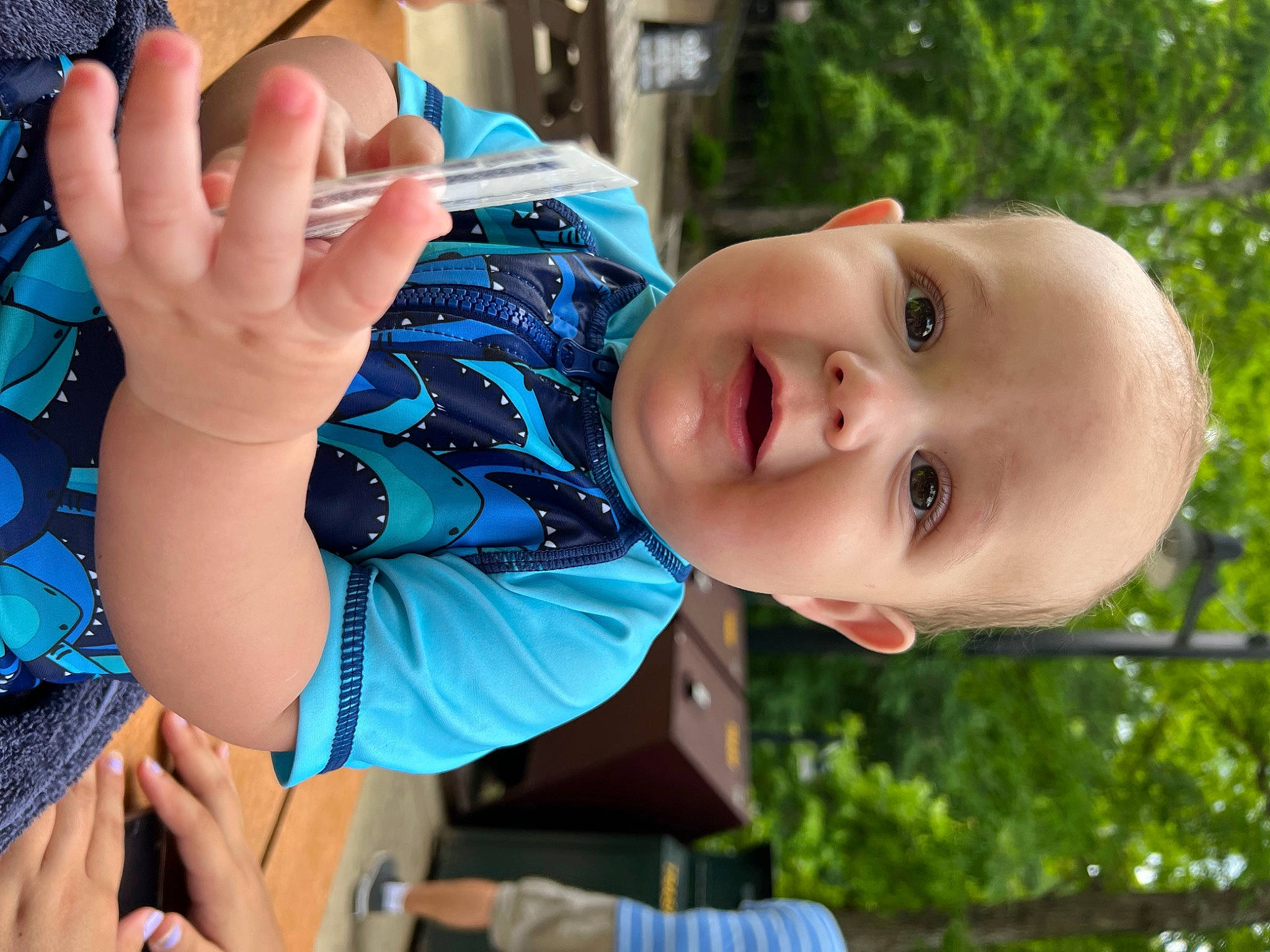 Phoenix is registered to the contest to win money with this photo: baby, baby_toddler_clothing, beauty, blue, child, cool, finger, fun, gesture, grass, happy, leaf, leisure, nose, person, plant, skin, thumb, toddler, tree