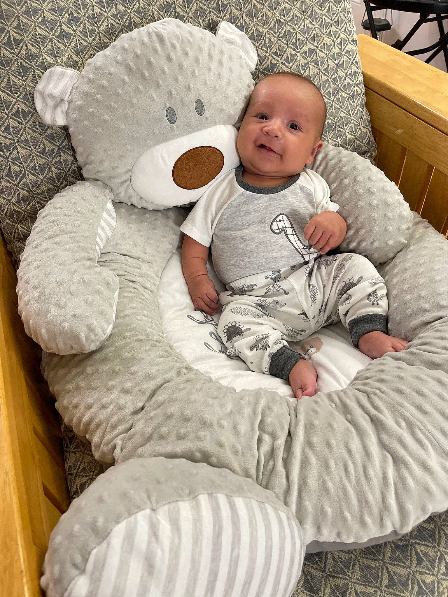 Athan is registered to the contest to win money with this photo: art, baby, baby_products, baby_sleeping, baby_toddler_clothing, bedding, child, comfort, fur, linens, person, pillow, room, sitting, skin, stuffed_toy, teddy_bear, textile, throw_pillow, toddler