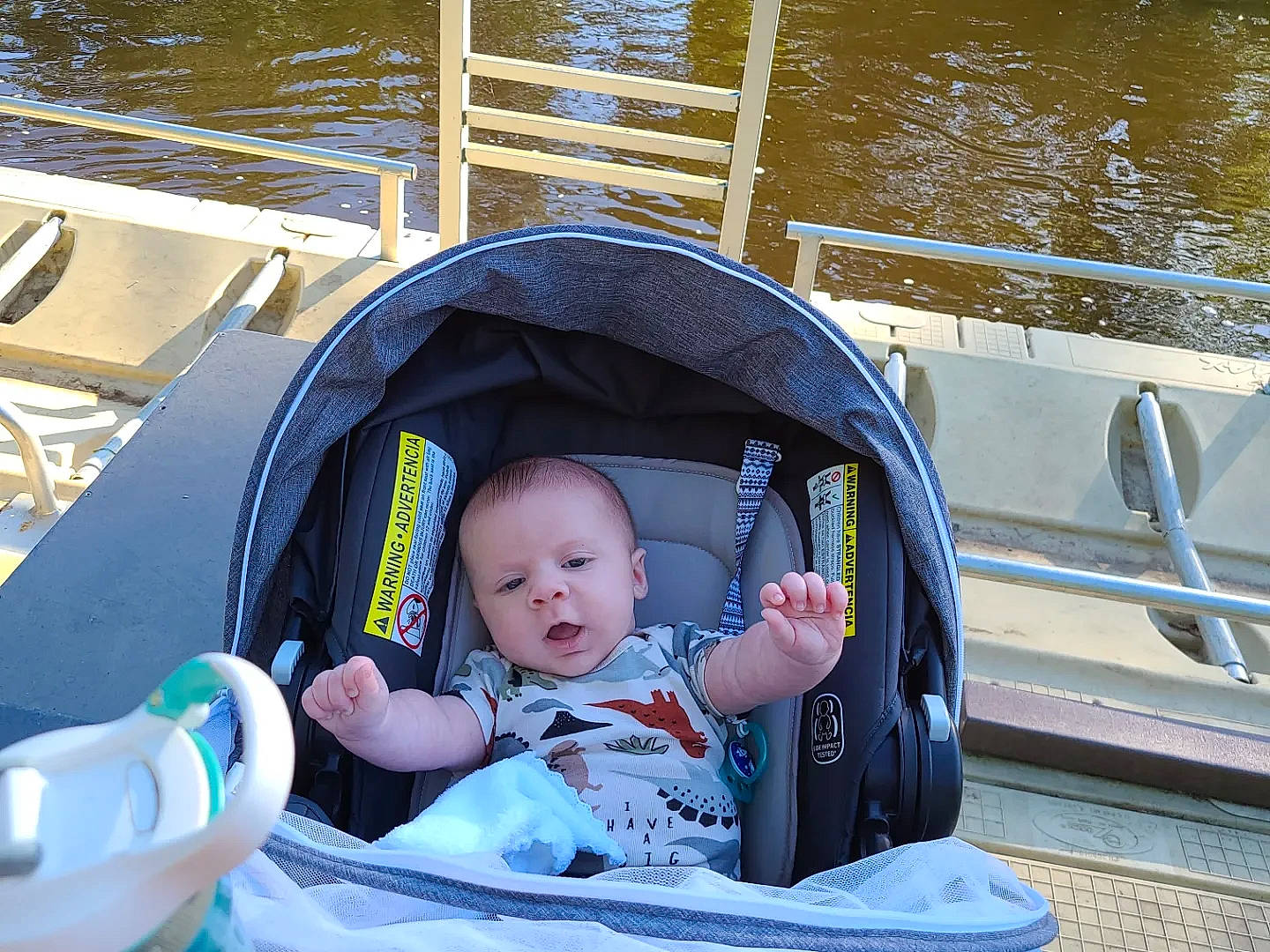 Charlie joined the competition — help win amazing prizes! baby, baby_carriage, baby_products, baby_toddler_clothing, boats_and_boating_equipment_and_supplies, child, comfort, face, fun, lake, lap, leisure, person, recreation, sitting, smile, toddler, travel, vacation, water